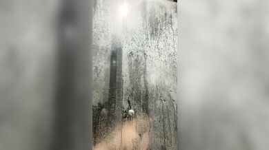Latina taking a shower and masturbating while her neighbor is watching her