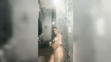 Latina taking a shower and masturbating while her neighbor is watching her