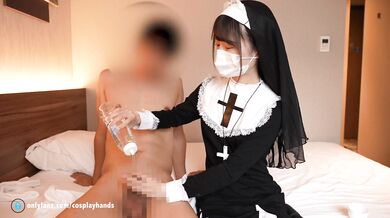 Japanese girl give a guy a hand job cosplayed as a nun